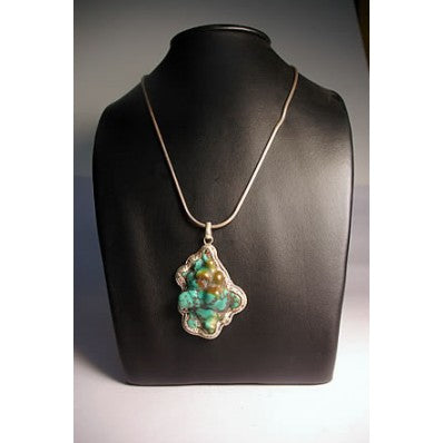 Pendentif tibétain en argent et turquoise ---